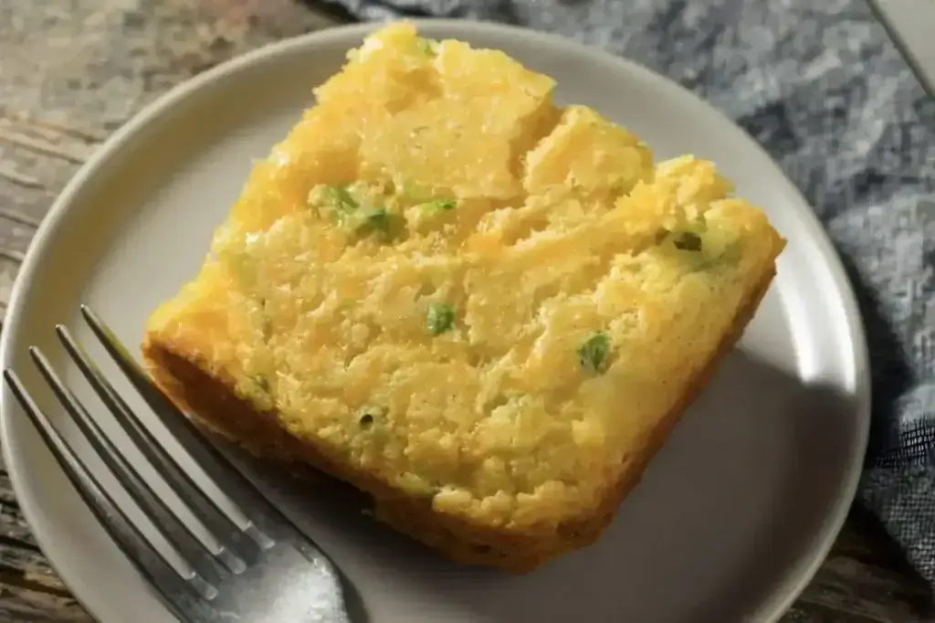 Jiffy Mexican Cornbread Recipe: Easy & Irresistible in 5 Min A slice of cheesy jalapeno cornbread, showcasing the delicious results of this easy cornbread recipe.